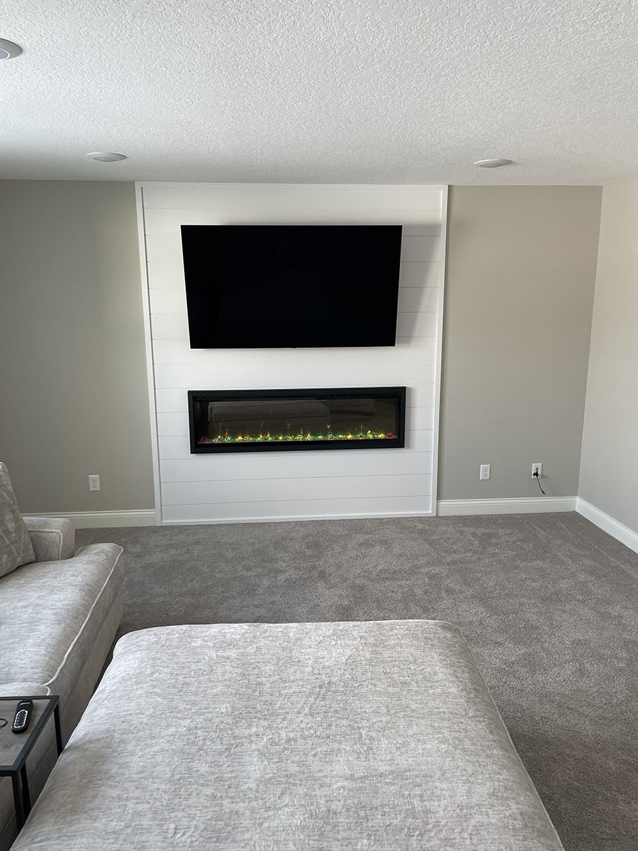 After picture of finished basement project with fireplace in Southeast metro, Minnesota.